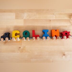 Maple Landmark NameTrain set spelling the name "COLIN".